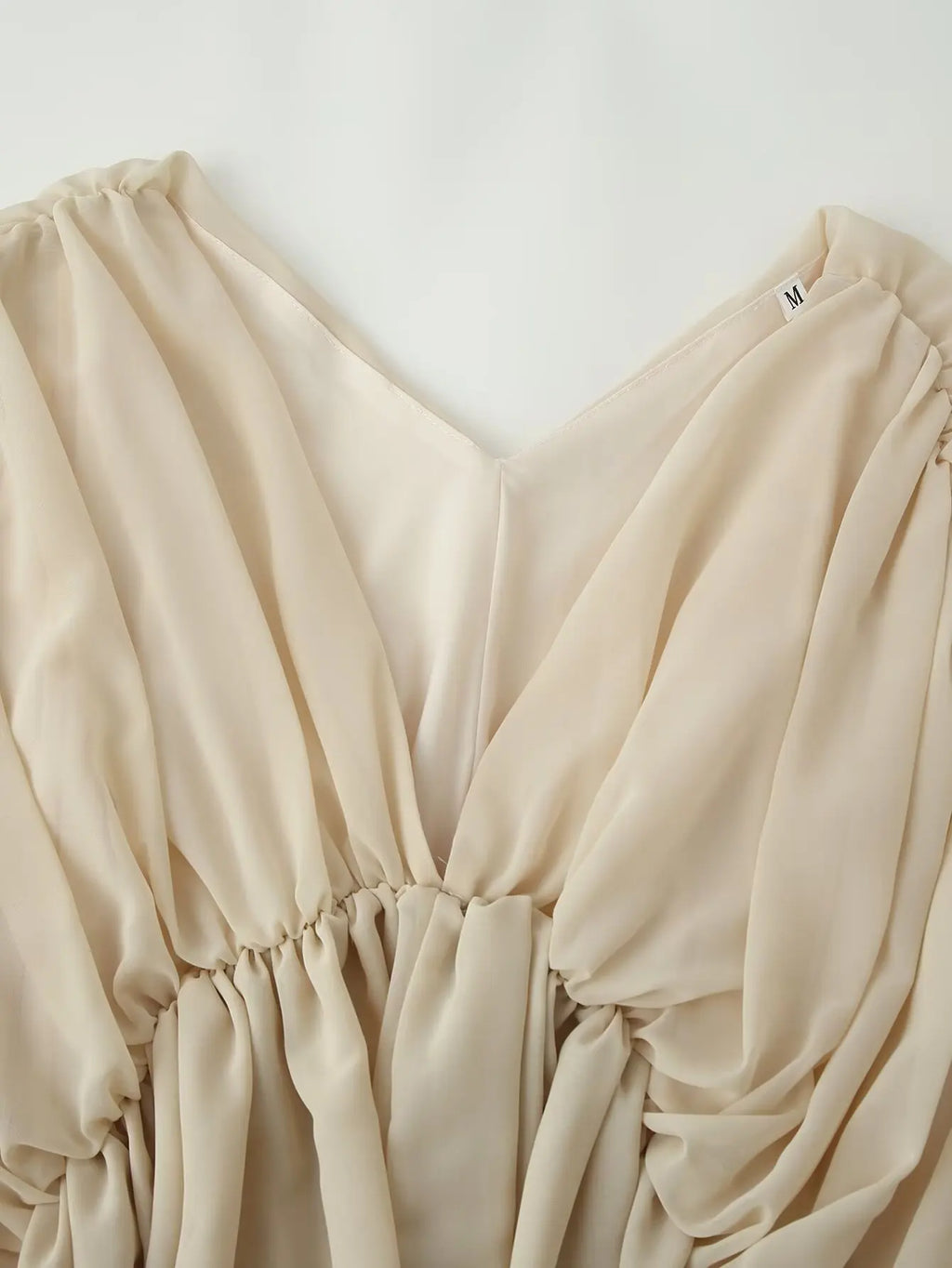 Blusa Kaki Escote V — Manga Murciélago Asimétrica
