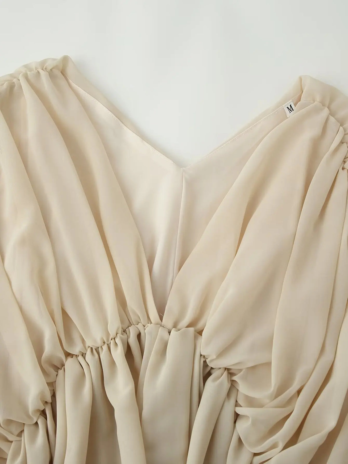 Blusa Kaki Escote V — Manga Murciélago Asimétrica